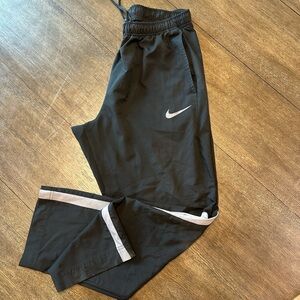 Nike Black Sweatpants with Tapered Cuffs and White Accents
